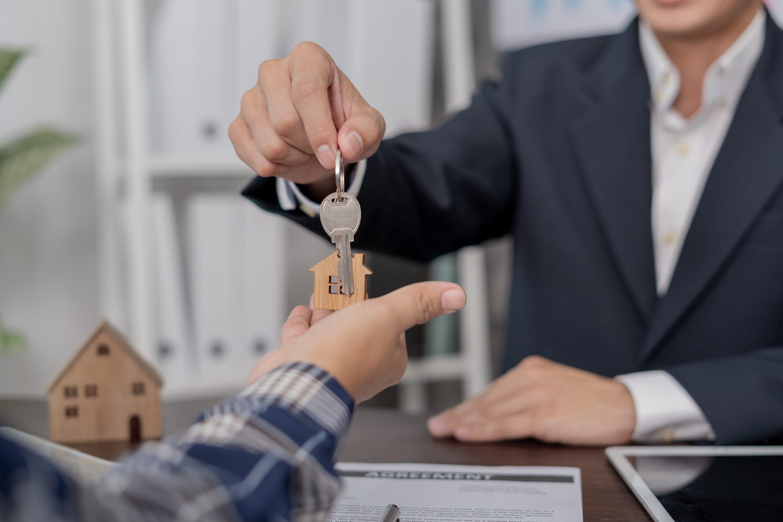 real estate agent olding key for new owner
