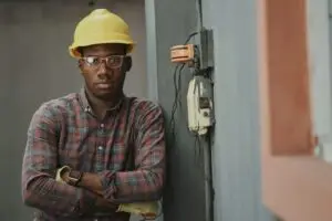 a man wearing a hard hat and glasses