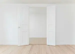 a white room with open doors