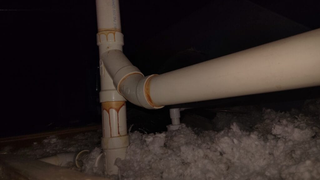 Pipe with signs of past leak.