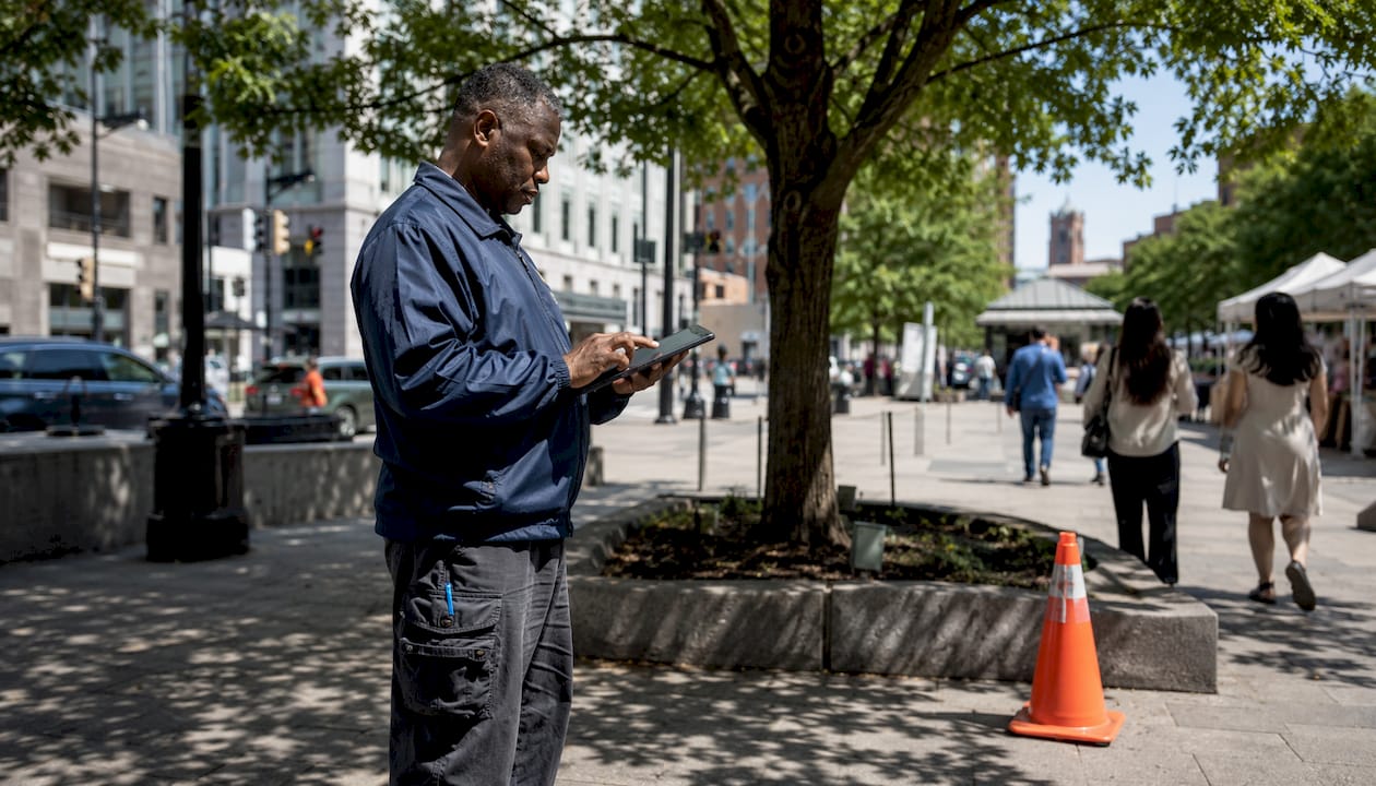 Inspector conducting commercial property inspection outdoors