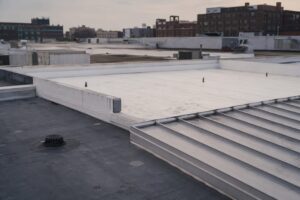 Commercial flat rooftop with multiple membrane roof types