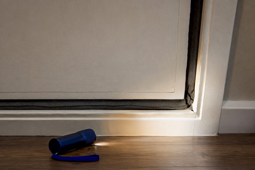 Worn weatherstripping around attic hatch