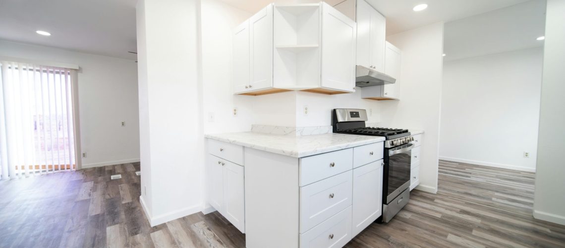 brian-wangenheim-R0aaUSmwZH8-unsplash a kitchen with white cabinets and a stove