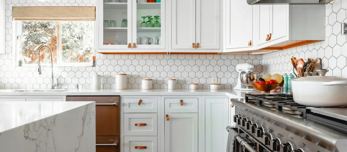 roam-in-color-z3QZ6gjGRt4-unsplash-scaled a kitchen with white cabinets and white countertops